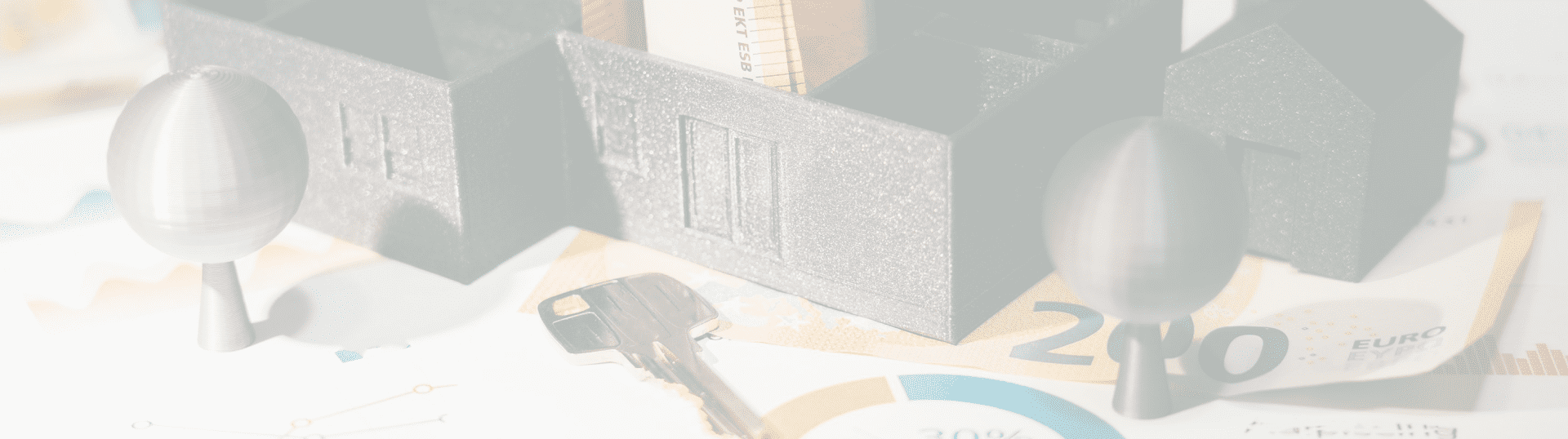 11 A key and some keys on top of a table.